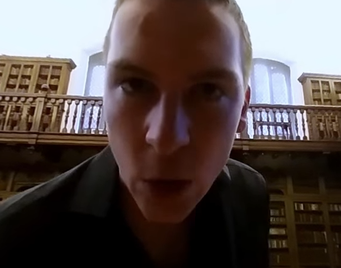 A face looms at the viewer in a 360 virtual reality performance.